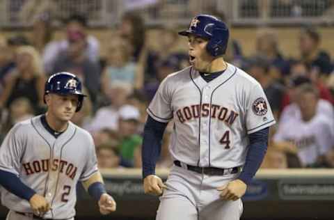 Aug 9, 2016; Minneapolis, MN, USA; Houston Astros right fielder George Springer (4) celebrates scoring a run in the sixth inning against the Minnesota Twins at Target Field. Mandatory Credit: Jesse Johnson-USA TODAY Sports