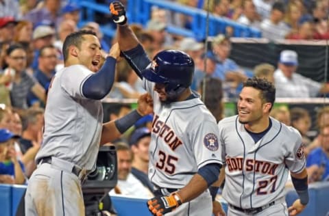 Aug 12, 2016; Toronto, Ontario, CAN; Houston Astros center fielder Teoscar Hernandez (35) is greeted by shortstop Carlos Correa (1) and second baseman Jose Altuve (27) after hitting a home run in his major league debut against Toronto Blue Jays in the fifth inning at Rogers Centre. Mandatory Credit: Dan Hamilton-USA TODAY Sports