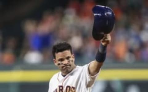 Aug 16, 2016; Houston, TX, USA; Houston Astros second baseman Jose Altuve (27) tips his helmet after getting career hit 1000 during the ninth inning against the St. Louis Cardinals at Minute Maid Park. Mandatory Credit: Troy Taormina-USA TODAY Sports