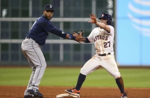 Sep 26, 2016; Houston, TX, USA; Houston Astros second baseman Jose Altuve (27) calls for timeout after stealing a base during the ninth inning as Seattle Mariners second baseman Robinson Cano (22) attempts to apply a tag at Minute Maid Park. Mandatory Credit: Troy Taormina-USA TODAY Sports