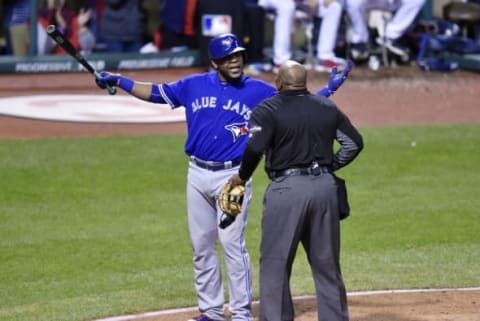 Oct 14, 2016; Cleveland, OH, USA; Toronto Blue Jays batter Edwin Encarnacion argues with umpire Laz Diaz after striking out against the Cleveland Indians in the 8th inning in game one of the 2016 ALCS playoff baseball series at Progressive Field. Mandatory Credit: David Richard-USA TODAY Sports