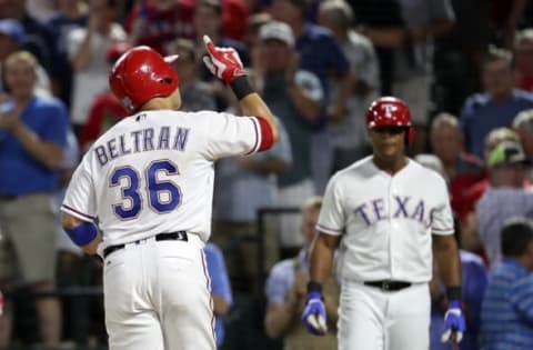 Sep 21, 2016; Arlington, TX, USA; Texas Rangers right fielder Carlos Beltran (36) reacts after hitting a two run home run during the fifth inning against the Los Angeles Angels at Globe Life Park in Arlington. Mandatory Credit: Kevin Jairaj-USA TODAY Sports