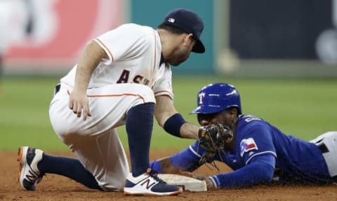 Sep 13, 2016; Houston, TX, USA; Texas Rangers third baseman Jurickson Profar (19) steals second base while Houston Astros second baseman Jose Altuve (27) is late with the tag in the ninth inning at Minute Maid Park. Texas won 3 to 2 . Mandatory Credit: Thomas B. Shea-USA TODAY Sports