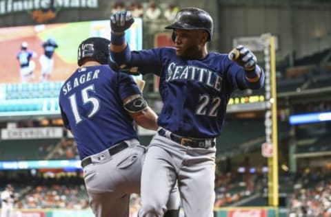 Sep 26, 2016; Houston, TX, USA; Seattle Mariners second baseman Robinson Cano (22) celebrates with third baseman Kyle Seager (15) after hitting a home run during the third inning against the Houston Astros at Minute Maid Park. Mandatory Credit: Troy Taormina-USA TODAY Sports