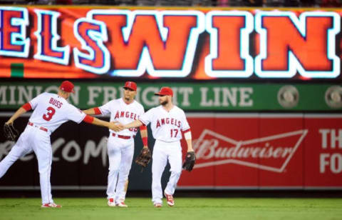 September 30, 2016; Anaheim, CA, USA; Los Angeles Angels left fielder Nick Buss (3), center fielder Rafael Ortega (39) and right fielder Shane Robinson (17) celebrate the 7-1 victory against the Houston Astros at Angel Stadium of Anaheim. Mandatory Credit: Gary A. Vasquez-USA TODAY Sports