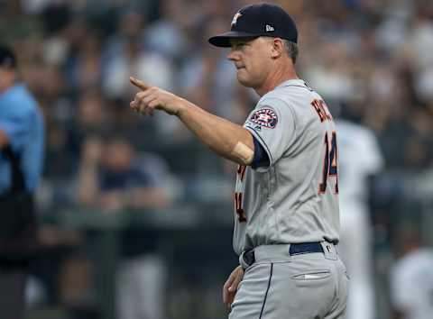 SEATTLE, WA – AUGUST 21: Houston Astros manager AJ Hinch gestures to the bullpen to replace starting pitcher Brad Peacock #41 of the Houston Astros with relief pitcher Framber Valdez #65 of the Houston Astros during the second inning of a game against the Seattle Mariners at Safeco Field on August 21, 2018 in Seattle, Washington. (Photo by Stephen Brashear/Getty Images)