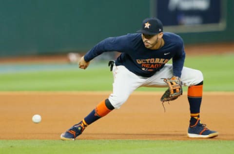 HOUSTON, TX – OCTOBER 17: Carlos Correa #1 of the Houston Astros warms up during batting practice before Game Four of the American League Championship Series against the Boston Red Sox at Minute Maid Park on October 17, 2018 in Houston, Texas. (Photo by Bob Levey/Getty Images)