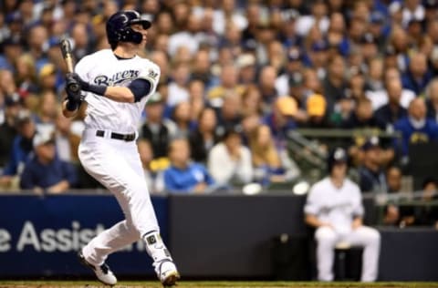 MILWAUKEE, WI – OCTOBER 20: Christian Yelich #22 of the Milwaukee Brewers hits a solo home run against Walker Buehler #21 of the Los Angeles Dodgers during the first inning in Game Seven of the National League Championship Series at Miller Park on October 20, 2018 in Milwaukee, Wisconsin. (Photo by Stacy Revere/Getty Images)