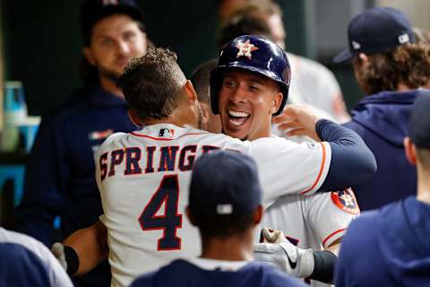 HOUSTON, TX – MAY 08: George Springer #4 of the Houston Astros congratulates Michael Brantley #23 after a two run home run in the third inning at Minute Maid Park on May 8, 2019 in Houston, Texas. (Photo by Tim Warner/Getty Images)