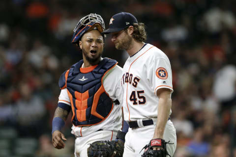 HOUSTON, TX – AUGUST 22: Martin Maldonado #12 of the Houston Astros talks with Gerrit Cole #45 after the top of the seventh inning against the Detroit Tigers at Minute Maid Park on August 22, 2019 in Houston, Texas. (Photo by Tim Warner/Getty Images)