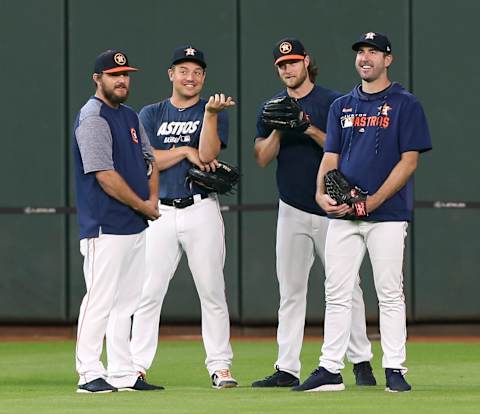 HOUSTON, TEXAS – AUGUST 03: (L-R) Wade Miley #20 of the Houston Astros, Joe Smith #38, Gerrit Cole #45 and Justin Verlander #35 chat during batting practice before a game against the Seattle Mariners at Minute Maid Park on August 03, 2019 in Houston, Texas. (Photo by Bob Levey/Getty Images)