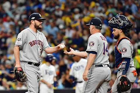 ST PETERSBURG, FLORIDA – OCTOBER 07: Wade Miley #20 of the Houston Astros reacts after being taken out of the game by manager AJ Hinch #14 during the seventh inning against the Tampa Bay Rays in Game Three of the American League Division Series at Tropicana Field on October 07, 2019 in St Petersburg, Florida. (Photo by Julio Aguilar/Getty Images)