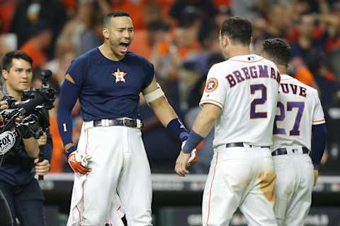 HOUSTON, TEXAS – OCTOBER 13: Carlos Correa #1 of the Houston Astros celebrates hitting a walk-off solo home run during the eleventh inning against the New York Yankees to win game two of the American League Championship Series 3-2 at Minute Maid Park on October 13, 2019 in Houston, Texas. (Photo by Bob Levey/Getty Images)