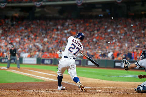 HOUSTON, TEXAS – OCTOBER 19: Jose Altuve #27 of the Houston Astros hits a walk-off two-run home run to win game six of the American League Championship Series 6-4 against the New York Yankees at Minute Maid Park on October 19, 2019 in Houston, Texas. (Photo by Bob Levey/Getty Images)