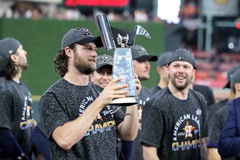 HOUSTON, TEXAS – OCTOBER 19: Gerrit Cole #45 of the Houston Astros celebrates with the trophy following his teams 6-4 win against the New York Yankees in game six of the American League Championship Series at Minute Maid Park on October 19, 2019 in Houston, Texas. (Photo by Elsa/Getty Images)