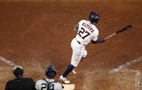 HOUSTON, TX – OCTOBER 19: Jose Altuve #27 of the Houston Astros hits a walk-off home run in the ninth inning against the New York Yankees during Game Six of the League Championship Series at Minute Maid Park on October 19, 2019 in Houston, Texas. (Photo by Tim Warner/Getty Images)