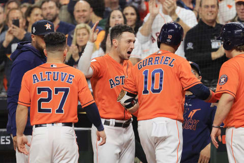 HOUSTON, TEXAS – OCTOBER 30: Yuli Gurriel #10 of the Houston Astros is congratulated by his teammate Alex Bregman #2 after hitting a solo home run against the Washington Nationals during the second inning in Game Seven of the 2019 World Series at Minute Maid Park on October 30, 2019, in Houston, Texas. (Photo by Mike Ehrmann/Getty Images)