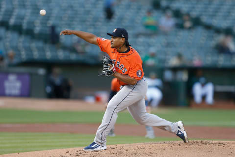 OAKLAND, CALIFORNIA - JULY 26: Luis Garcia #77 of the Houston Astros pitches in the bottom of the first inning against the Oakland Athletics at RingCentral Coliseum on July 26, 2022 in Oakland, California. (Photo by Lachlan Cunningham/Getty Images)