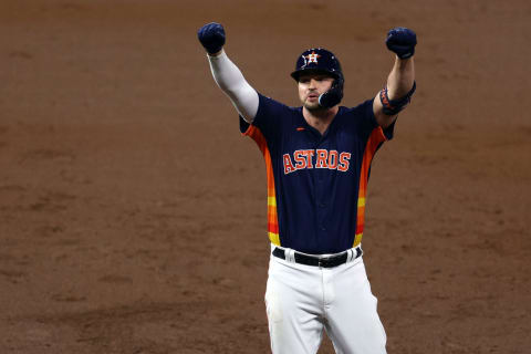 HOUSTON, TEXAS – NOVEMBER 05: Trey Mancini #26 of the Houston Astros reacts after hitting a single against the Philadelphia Phillies during the third inning in Game Six of the 2022 World Series at Minute Maid Park on November 05, 2022 in Houston, Texas. (Photo by Rob Carr/Getty Images)