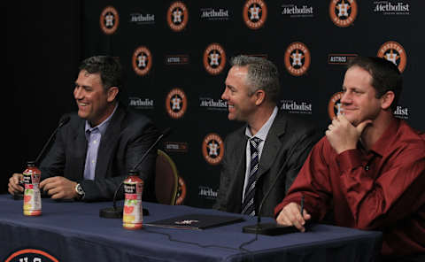 HOUSTON, TX – APRIL 05: Lance Berkman, Reid Ryan, President of Business Opeations and Roy Oswalt, from left, take questions from the media at Minute Maid Park on April 5, 2014 in Houston, Texas. Berkman and Oswalt signed one day personal services contracts to retire as Houston Astros. (Photo by Bob Levey/Getty Images)