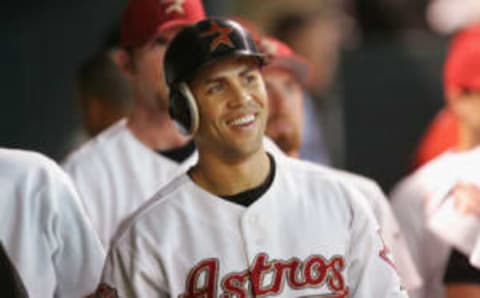 HOUSTON – OCTOBER 16: Carlos Beltran #15 of the Houston Astros smiles in the dugout after hitting a solo home run in eighth inning of Game 3 of National League Championship Series against the St. Louis Cardinals during the 2004 Major League Baseball Playoffs on October 16, 2004 at Minute Maid Park in Houston, Texas. (Photo By Ronald Martinez/Getty Images)