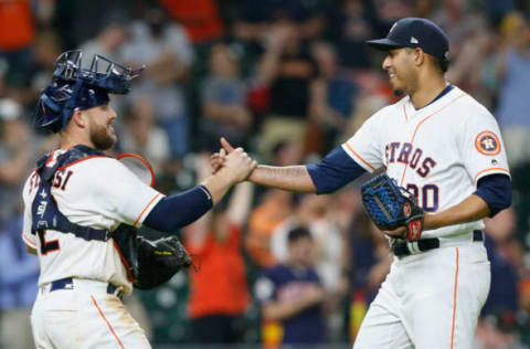 HOUSTON, TX – MAY 22: Hector Rondon #30 of the Houston Astros shakes hands with Max Stassi #12 after the final out against the San Francisco Giants at Minute Maid Park on May 22, 2018 in Houston, Texas. (Photo by Bob Levey/Getty Images)