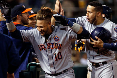 OAKLAND, CA – SEPTEMBER 08: Yuli Gurriel #10 of the Houston Astros is congratulated by Carlos Correa #1 after hitting a two run home run against the Oakland Athletics during the third inning at the Oakland Coliseum on September 8, 2017 in Oakland, California. The Oakland Athletics defeated the Houston Astros 9-8. (Photo by Jason O. Watson/Getty Images)