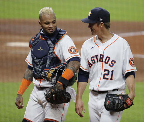 HOUSTON, TEXAS – AUGUST 29: Zack Greinke #21 of the Houston Astros talks with Martin Maldonado #15 as they walk to the dugout after retiring the Oakland Athletics during game two of a doubleheader at Minute Maid Park on August 29, 2020 in Houston, Texas. (Photo by Bob Levey/Getty Images)