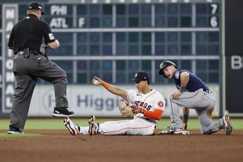 HOUSTON, TEXAS – OCTOBER 11: Jeremy Pena #3 of the Houston Astros reacts after tagging out Jarred Kelenic #10 of the Seattle Mariners as he attempted to steal second base during the eighth inning in game one of the American League Division Series at Minute Maid Park on October 11, 2022 in Houston, Texas. (Photo by Bob Levey/Getty Images)