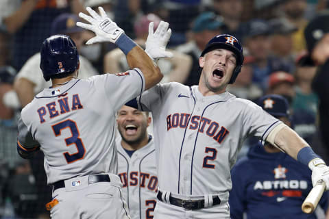 Jeremy Pena #3 of the Houston Astros reacts with Alex Bregman #2 after hitting a solo home run during the eighteenth inning against the Seattle Mariners in game three of the American League Division Series at T-Mobile Park on October 15, 2022 in Seattle, Washington. (Photo by Steph Chambers/Getty Images)