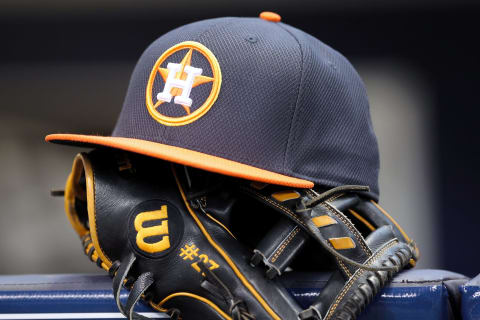 MILWAUKEE, WISCONSIN – APRIL 10: Jose Altuve #27 of Houston Astros rests his hat and glove in the dugout before the game against the Milwaukee Brewers at Miller Park on April 10, 2016 in Milwaukee, Wisconsin. (Photo by Dylan Buell/Getty Images)