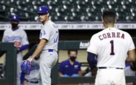 HOUSTON, TEXAS – JULY 28: Joe Kelly #17 of the Los Angeles Dodgers has words with Carlos Correa #1 of the Houston Astros as he walks towards the dugout at Minute Maid Park on July 28, 2020 in Houston, Texas. Both benches would empty after Kelly had thrown high inside pitches at Correa, Bregman and Guriel in the sixth inning. (Photo by Bob Levey/Getty Images)