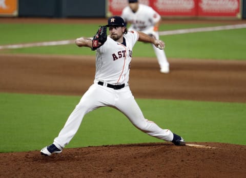 HOUSTON, TEXAS – AUGUST 29: Blake Taylor #62 of the Houston Astros pitches against the Oakland Athletics during game two of a doubleheader at Minute Maid Park on August 29, 2020 in Houston, Texas. (Photo by Bob Levey/Getty Images)