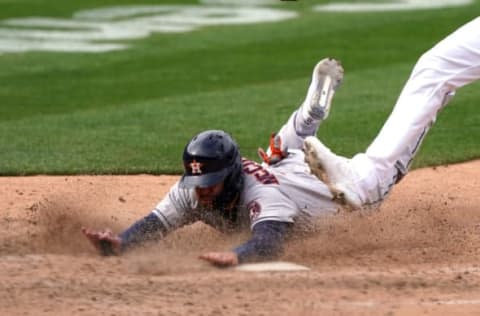 Apr 3, 2021; Oakland, California, USA; Houston Astros right fielder Chas McCormick (6) slides to score a run during the ninth inning against the Oakland Athletics at RingCentral Coliseum. Mandatory Credit: Darren Yamashita-USA TODAY Sports