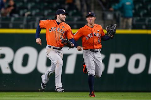 Sep 28, 2015; Seattle, WA, USA; Houston Astros center fielder Jake Marisnick (6) and right fielder George Springer (4) run back to the dugout after the final out of a 3-2 victory against the Seattle Mariners at Safeco Field. Mandatory Credit: Joe Nicholson-USA TODAY Sports