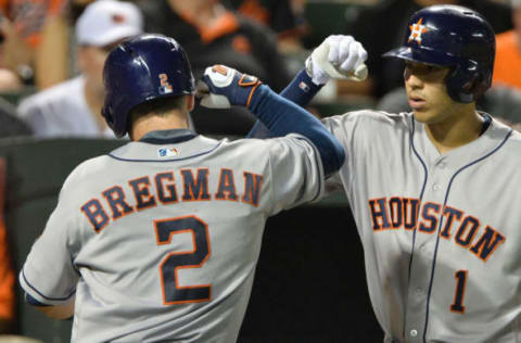 Aug 18, 2016; Baltimore, MD, USA; Houston Astros third baseman Bregman (2) celebrates with shortstop Correa (1) after his solo home run during the sixth inning against the Baltimore Orioles at Oriole Park at Camden Yards. Mandatory Credit: Tommy Gilligan-USA TODAY Sports