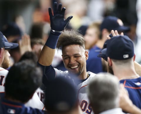 Sep 14, 2016; Houston, TX, USA; Houston Astros designated hitter Yulieski Gurriel (10) celebrates in the dugout after scoring a run during the eighth inning against the Texas Rangers at Minute Maid Park. Mandatory Credit: Troy Taormina-USA TODAY Sports