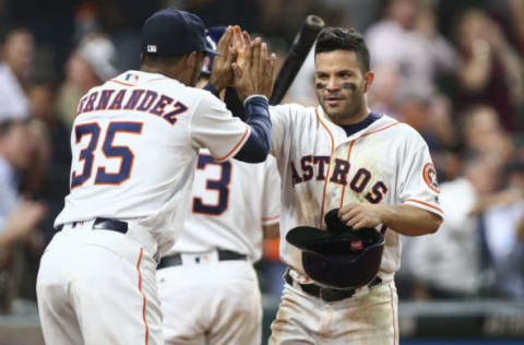 Sep 26, 2016; Houston, TX, USA; Houston Astros second baseman Jose Altuve (27) celebrates with teammates after scoring a run during the ninth inning against the Seattle Mariners at Minute Maid Park. Mandatory Credit: Troy Taormina-USA TODAY Sports