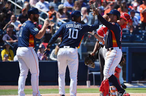 Mar 15, 2017; West Palm Beach, FL, USA; Houston Astros right fielder Jon Kemmer (75) celebrates his two-run home run with designated hitter Evan Gattis (11) and third baseman Yuli Gurriel (10) during a spring training game against the Washington Nationals at The Ballpark of the Palm Beaches. Mandatory Credit: Jasen Vinlove-USA TODAY Sports