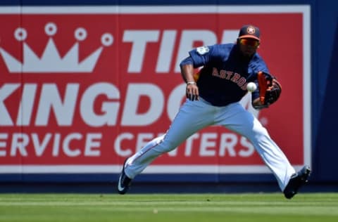 Mar 19, 2017; West Palm Beach, FL, USA; Houston Astros left fielder Teoscar Hernandez (35) fields a ball in the outfield against the New York Yankees during a spring training game at The Ballpark of the Palm Beaches. Mandatory Credit: Jasen Vinlove-USA TODAY Sports