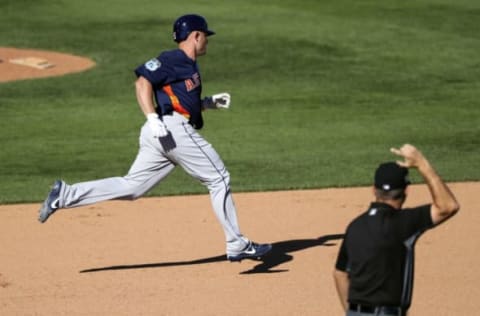 Feb 26, 2017; Lake Buena Vista, FL, USA; Houston Astros catcher Max Stassi (12) runs the bases after hitting a home run in the eighth inning against the Atlanta Braves at Champion Stadium. Mandatory Credit: Logan Bowles-USA TODAY Sports