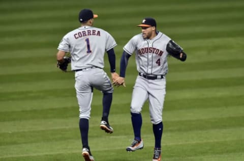 Sep 6, 2016; Cleveland, OH, USA; Houston Astros right fielder George Springer (4) and shortstop Carlos Correa (1) celebrate a 4-3 win over the Cleveland Indians at Progressive Field. Mandatory Credit: David Richard-USA TODAY Sports