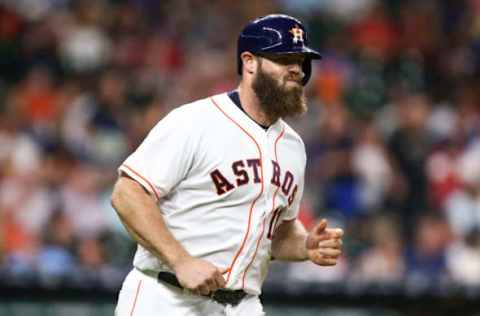 Sep 14, 2016; Houston, TX, USA; Houston Astros catcher Evan Gattis (11) hits a single during the second inning against the Texas Rangers at Minute Maid Park. Mandatory Credit: Troy Taormina-USA TODAY Sports