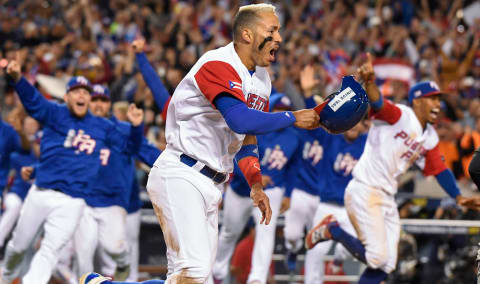 Mar 20, 2017; Los Angeles, CA, USA; Puerto Rico infielder Carlos Correa (1) reacts after scoring the winning run in the bottom of the 11th inning against the Netherlands during the 2017 World Baseball Classic at Dodger Stadium. Puerto Rico advances to the finals. Mandatory Credit: Robert Hanashiro-USA TODAY Sports