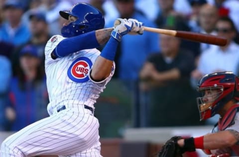 October 13, 2015; Chicago, IL, USA; Chicago Cubs second baseman Javier Baez (9) hits a three run home run in the second inning against St. Louis Cardinals in game four of the NLDS at Wrigley Field. Mandatory Credit: Jerry Lai-USA TODAY Sports