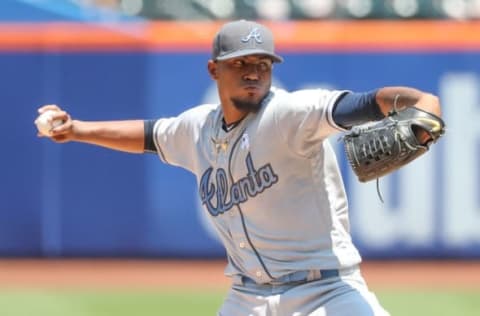 Jun 19, 2016; New York City, NY, USA; Atlanta Braves starting pitcher Julio Teheran (49) pitches during the first inning against the New York Mets at Citi Field. Mandatory Credit: Anthony Gruppuso-USA TODAY Sports