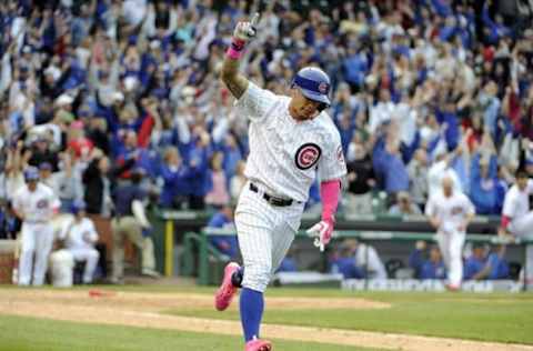 May 8, 2016; Chicago, IL, USA; Chicago Cubs third baseman Javier Baez (9) hits a walk off home run against the Washington Nationals during the thirteenth inning at Wrigley Field. The Cubs won 4-3 in thirteen innings. Mandatory Credit: David Banks-USA TODAY Sports