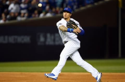 Oct 22, 2016; Chicago, IL, USA; Chicago Cubs second baseman Javier Baez (9) throws to first base for a double play against the Los Angeles Dodgers during the first inning of game six of the 2016 NLCS playoff baseball series at Wrigley Field. Mandatory Credit: Jerry Lai-USA TODAY Sports