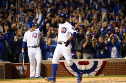 Oct 22, 2016; Chicago, IL, USA; Chicago Cubs center fielder Dexter Fowler (24) scores against the Los Angeles Dodgers during the first inning of game six of the 2016 NLCS playoff baseball series at Wrigley Field. Mandatory Credit: Jerry Lai-USA TODAY Sports