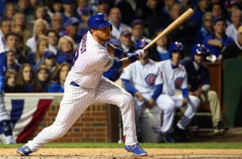 Oct 22, 2016; Chicago, IL, USA; Chicago Cubs left fielder Ben Zobrist (18) hits an RBI sacrifice fly against the Los Angeles Dodgers during the first inning of game six of the 2016 NLCS playoff baseball series at Wrigley Field. Mandatory Credit: Jerry Lai-USA TODAY Sports